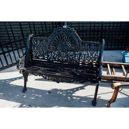 651 - Decorative cast iron three seater garden bench.