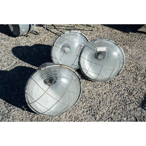 653 - Set of three 1950's industrial hanging lamps.