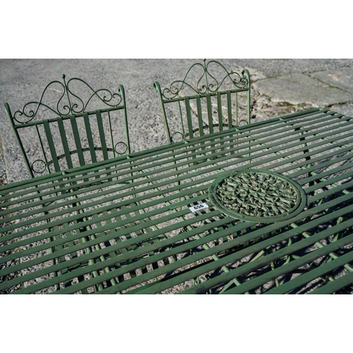 656 - Decorative metal garden table and 6 chairs.