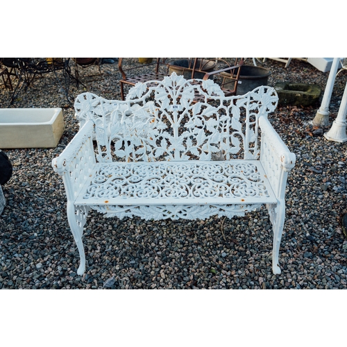 674 - Pair of decorative cast iron garden benches with Oak leaf and Rams head design.