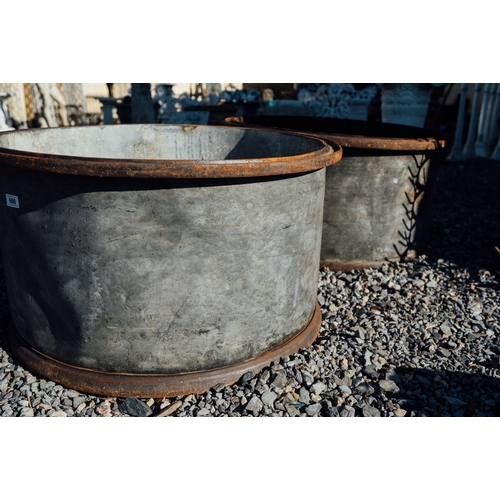 680 - Pair of large circular metal planters.