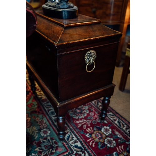 96 - Georgian mahogany cellarette on turned legs and brass mounts.