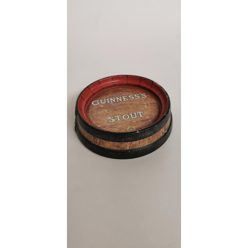 129 - Guinness Stout ceramic ashtray. { 12cm Dia. }.