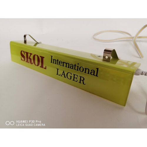 34 - Skol International Lager advertising shelf light.  { 7cm H X 30cm W }.