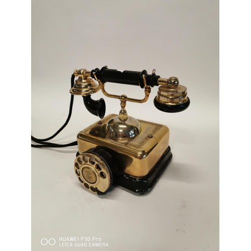 352 - Bakelite and brass telephone. { 22cm H X 19cm Sq. }.