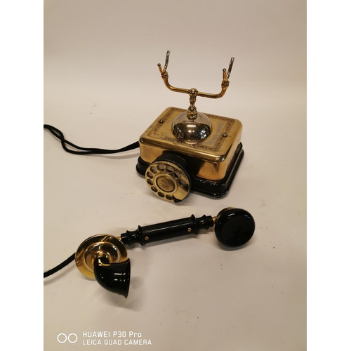 352 - Bakelite and brass telephone. { 22cm H X 19cm Sq. }.