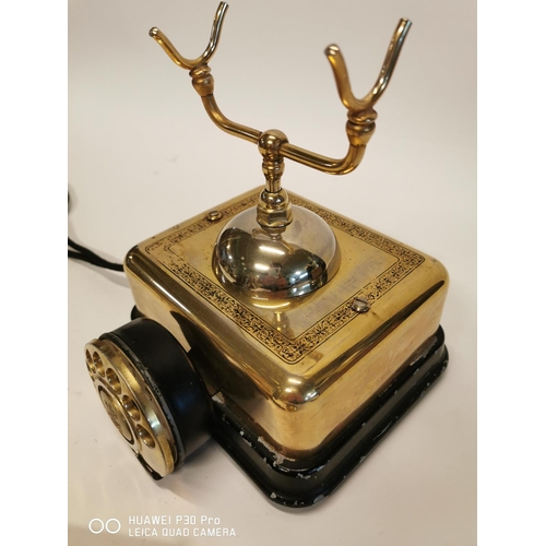 352 - Bakelite and brass telephone. { 22cm H X 19cm Sq. }.