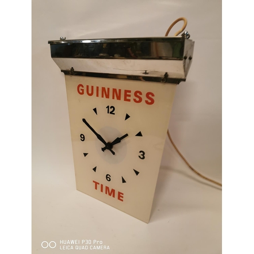 358 - Guinness Time chrome and perspex advertising clock. { 44cm H X 35cm W }.