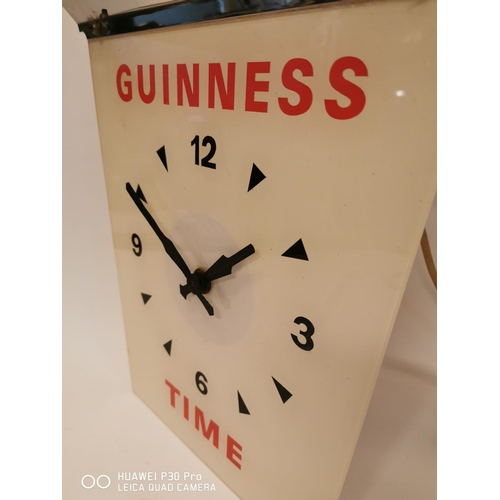 358 - Guinness Time chrome and perspex advertising clock. { 44cm H X 35cm W }.