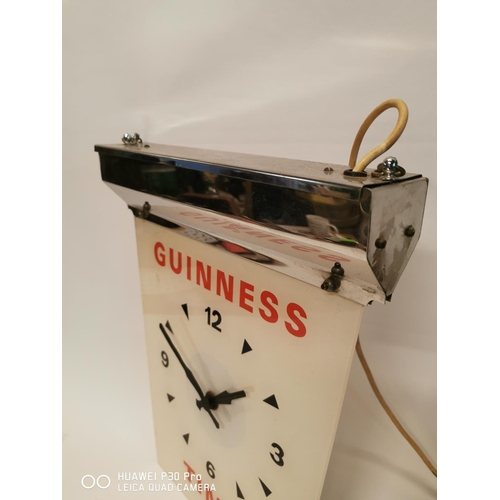 358 - Guinness Time chrome and perspex advertising clock. { 44cm H X 35cm W }.