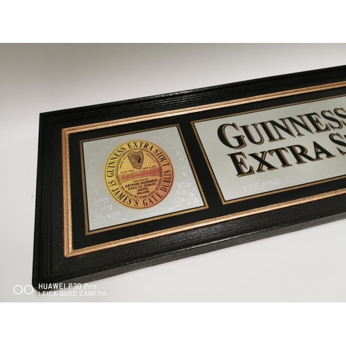 361 - Guinness & Co Extra Stout advertising mirror. {54cm H X 170cm W }.