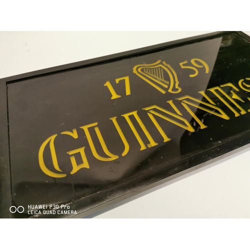 364 - 1759 Guinness advertisement on glass. {34cm H X 63cm W }.