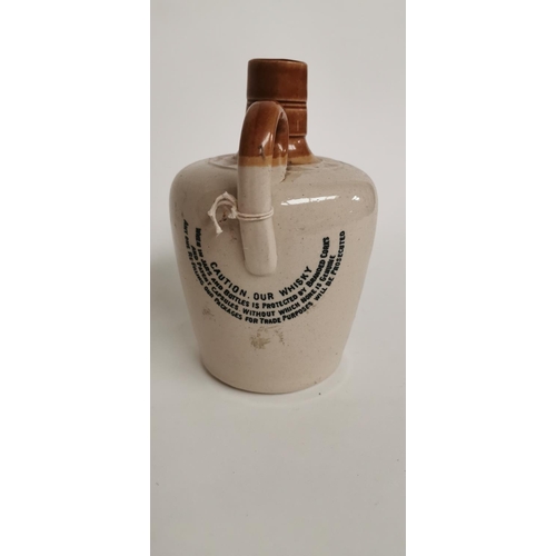 83 - Mitchell's Cruiskeen Lawn Old Irish Whiskey flagon.  { 18cm H }.