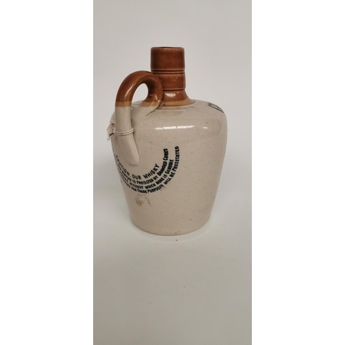 83 - Mitchell's Cruiskeen Lawn Old Irish Whiskey flagon.  { 18cm H }.