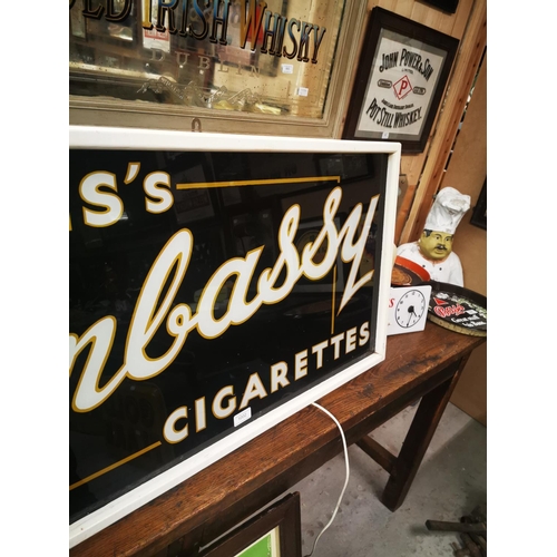 1002 - Wills's Embassy Cigarettes reverse painted glass framed advertising sign {52 cm H x 97 cm W}.