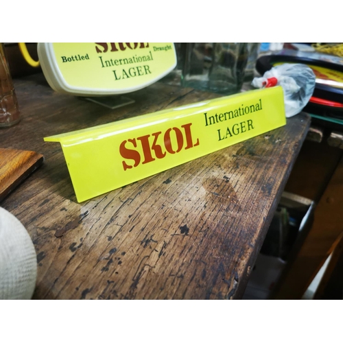 1015 - Skol International Lager advertising shelf light.  {5cm H X 30cm W }.