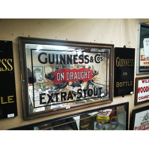 1022 - Guinness & Co's on Draught Extra Stout framed advertising mirror {59 cm H x 85 cm W}.