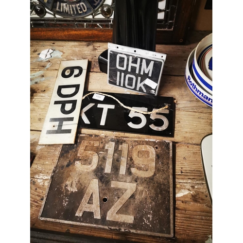 1050 - Collection of old car number plates.