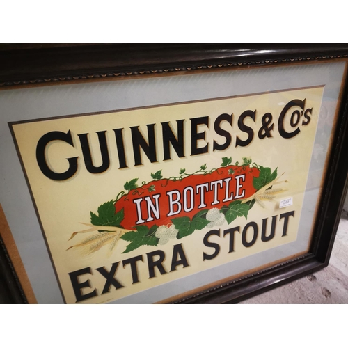 1072 - Guinness In Bottle Extra Stout framed advertising print {65 cm H x 84 cm W}.