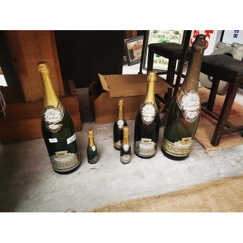 1089 - Set of six graduating Gosset display champagne bottles {Largest 67 cm H and Smallest 23cm H}.