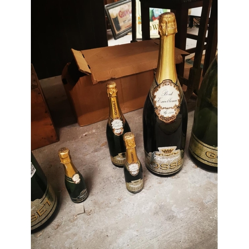 1089 - Set of six graduating Gosset display champagne bottles {Largest 67 cm H and Smallest 23cm H}.