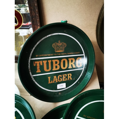 1202 - Three Tuborg Lager tinplate advertising drinks trays {30 cm Dia.}.