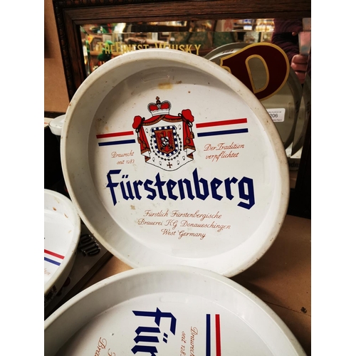 1203 - Three Furstenburg tinplate advertising drinks trays {33 cm Dia.}.