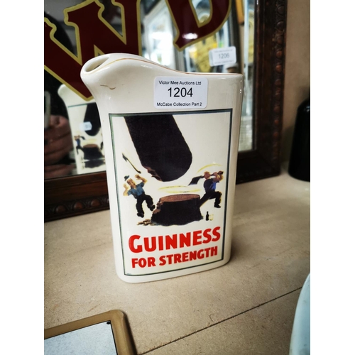 1204 - Guinness For Strength ceramic advertising jug {18 cm H}.