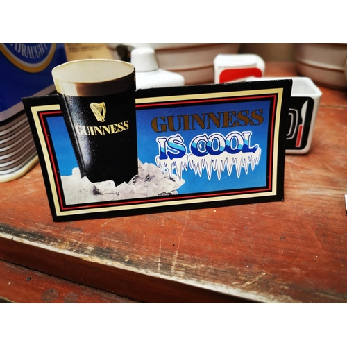 1223 - Two Guinness advertising shelf signs {8 cm H x 13 cm W}.