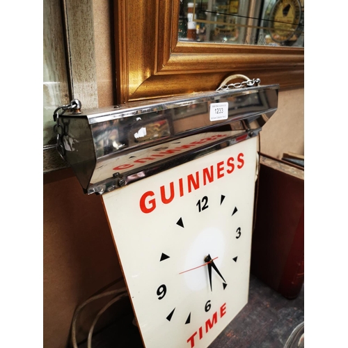 1233 - Guinness Time hanging advertising clock {43 cm H x 34 cm W}.