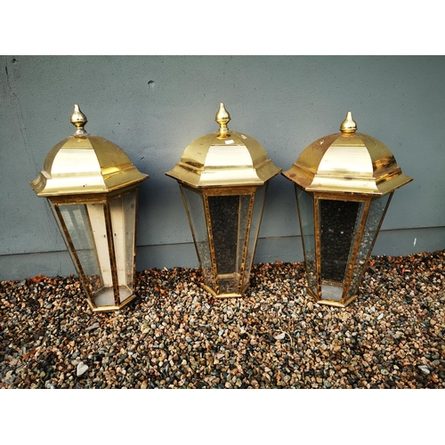 1259 - Three brass pub lanterns {Roughly 101 cm H x 56 cm W}