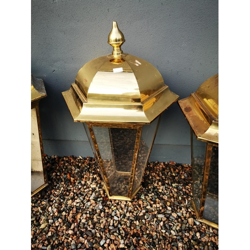 1259 - Three brass pub lanterns {Roughly 101 cm H x 56 cm W}