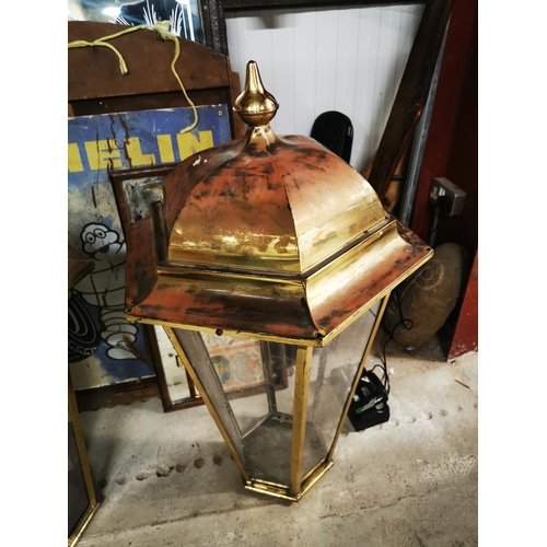 1260 - Two brass pub lanterns {Roughly 101 cm H x 56 cm W}