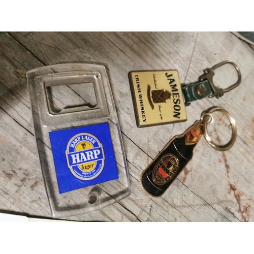 135 - Set of Guinness cufflinks, Guinness keyring, Jameson keyring and Harp cork puller.