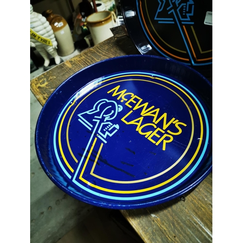 167 - Two McEwan's Lager drink's trays { each 30cm Dia. }.