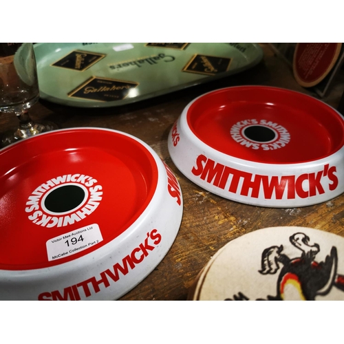 194 - Two Smithwick's tinplate ashtrays