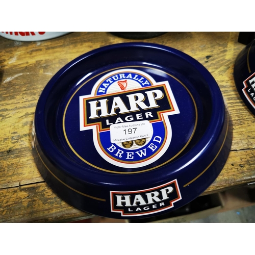 197 - Two Harp Lager tinplate ashtrays.