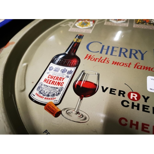 209 - Cherry Heering World's Most Famous Cherry Brandy tinplate drink's tray. { 34cm Dia }.