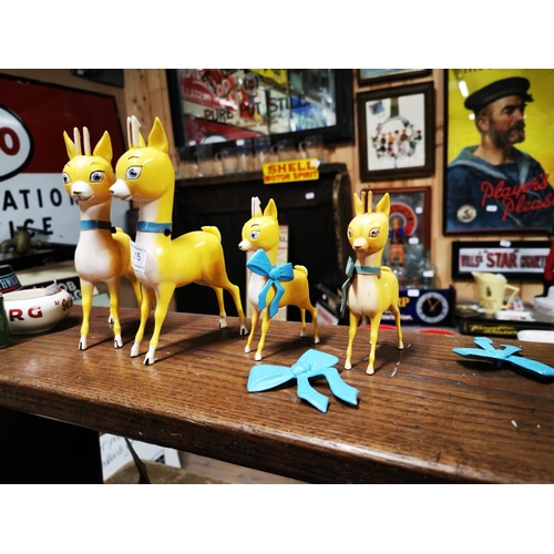 215 - Four Babycham advertising figures.