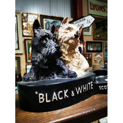 224 - Black and White Scotch Whiskey Ruberoid advertising dogs with bottle holder . { 15cm H X 31cm W }.