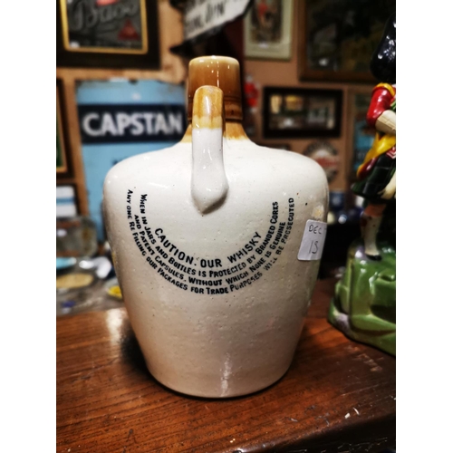 226 - Mitchel's Cruiskeen Lawn stoneware advertising flagon  { 20cm H X 13cm W }. .