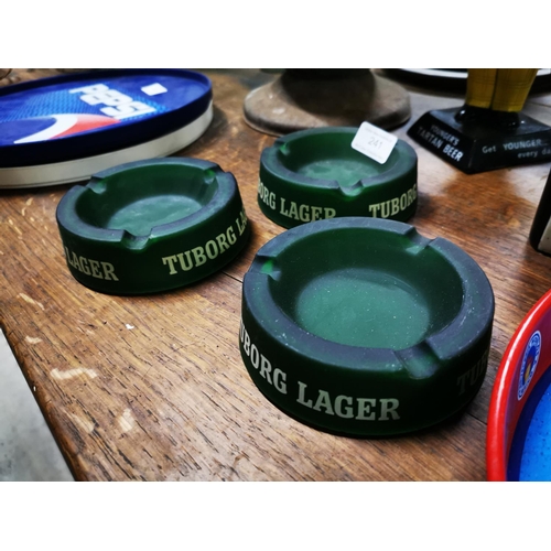 241 - Three Tuborg Lager glass ashtrays.