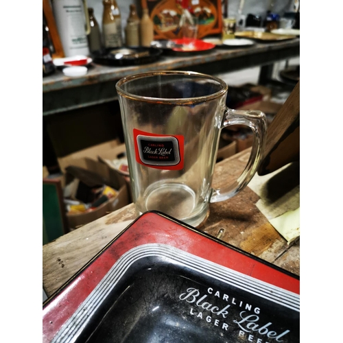 282 - Black Label ceramic ashtray and pint glass.