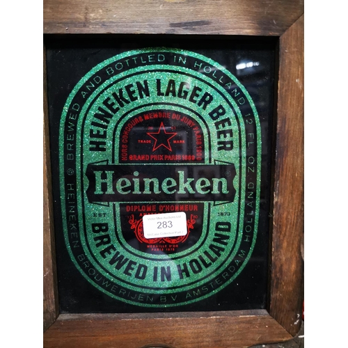 283 - Heineken Lager framed advertisement { 31cm H X 25cm W }.