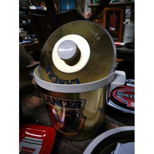 284 - Lancer Harp Lager ice bucket { 23cm H X 24cm Dia }  and Smithwick's tinplate ashtray .