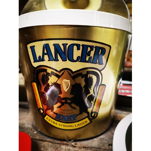 284 - Lancer Harp Lager ice bucket { 23cm H X 24cm Dia }  and Smithwick's tinplate ashtray .