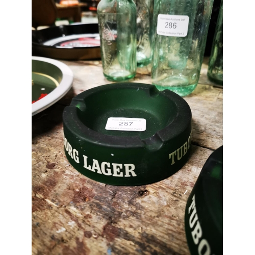 287 - Two Tuborg green glass ashtrays