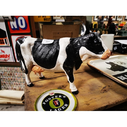 307 - Cast iron model of a Freisen cow. { 20cm H X 34cm W }.