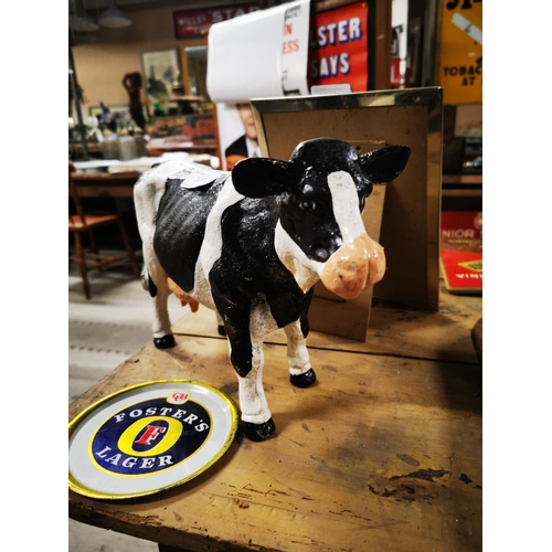 307 - Cast iron model of a Freisen cow. { 20cm H X 34cm W }.