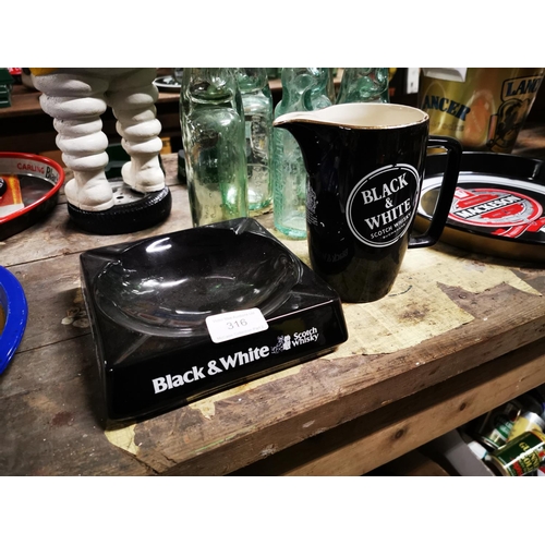 316 - Black and White Scotch Whiskey ceramic water jug and ashtray .